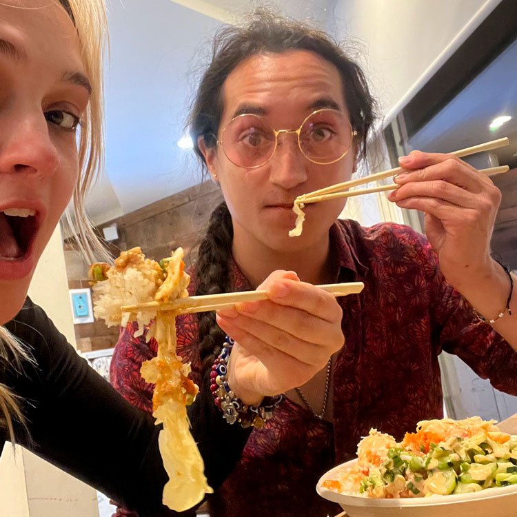 Photo of Oliver enjoying his poke bowl